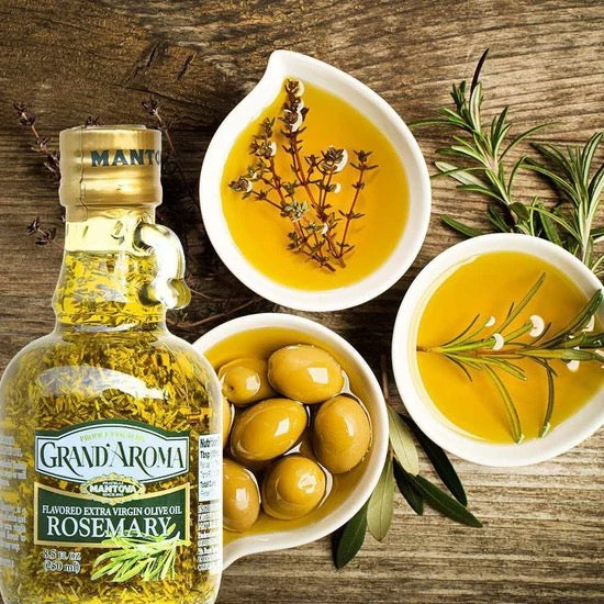Bottle of Grand Aroma Rosemary olive oil with bowls of olives and rosemary on a wooden surface