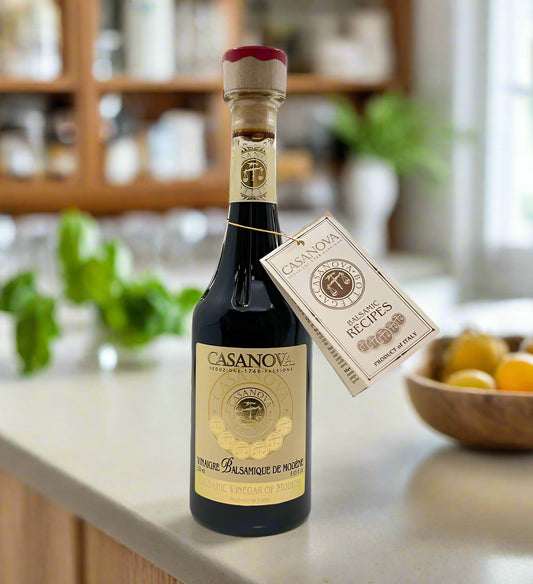 Bottle of Casanov balsamic vinegar with a tag on a white background